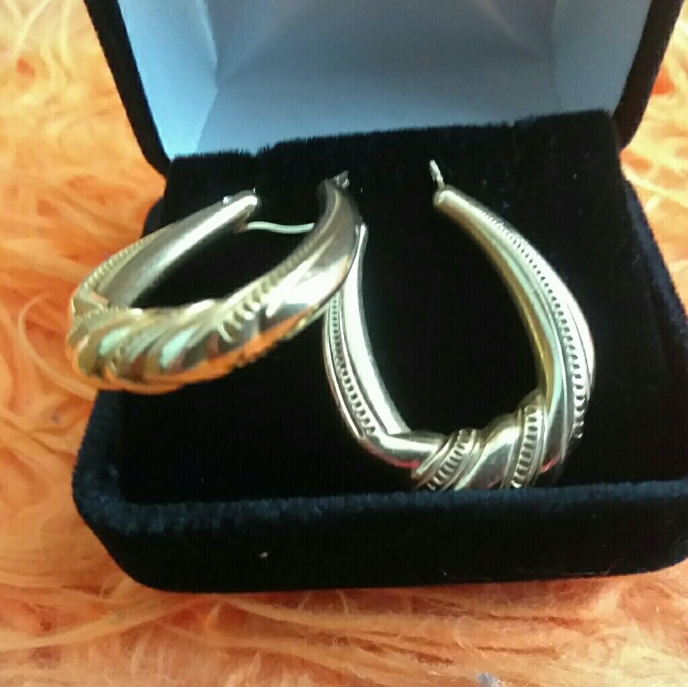 A 14k pair of long hoops earrings